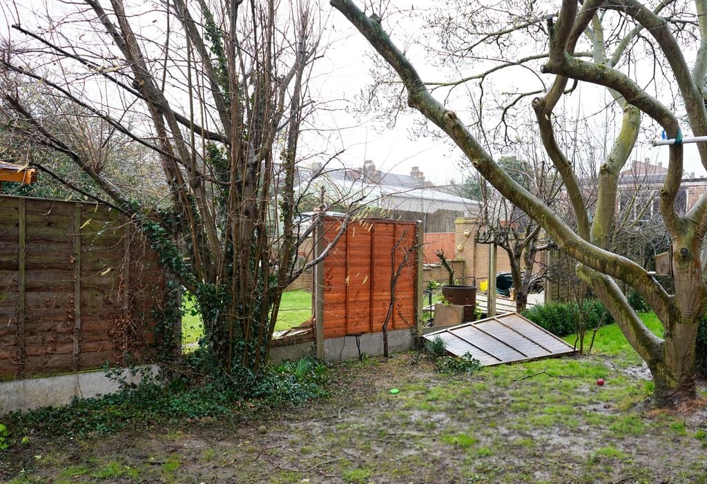 Garden fence knocked down during storm Ciara, Kent, UK