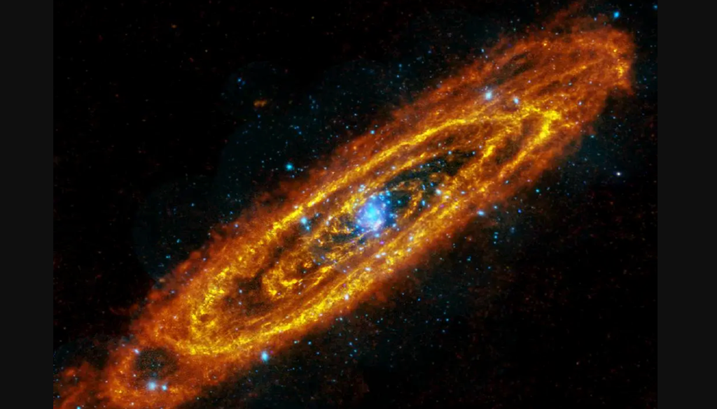 Immagine della galassia di Andromeda ottenuta combinando un'immagine nella banda infrarossa ottenuta dal telescopio spaziale Herschel (in colore arancione) e dal telescopio XMM-Newton nella banda X (colore blu). Credit: ESA/Herschel/PACS/SPIRE/J. Fritz, U. Gent; X-ray: ESA/XMM Newton/EPIC/W. Pietsch, MPE