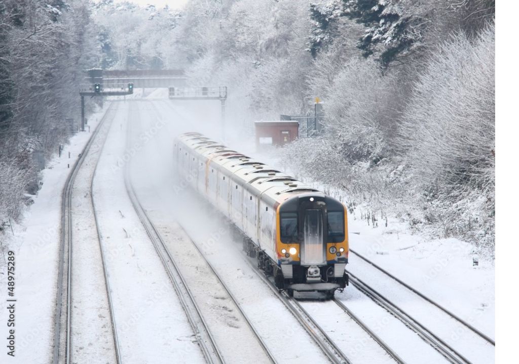 Train passing through the snow