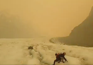 Australian bushfire smoke clouds view at New Zealand glacier