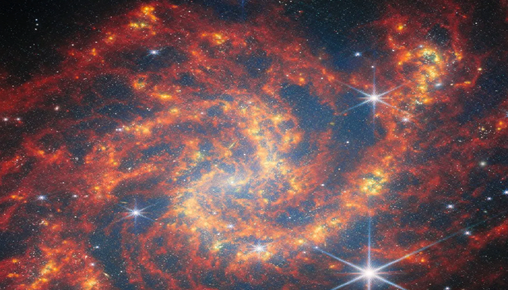 I grumi brillanti lungo i bracci di spirale di questa galassia, la NGC 2283, mostrano come appaiono agli occhi del telescopio spaziale James Webb le regioni di formazione stellare. Credit: ESA/Webb, NASA & CSA, A. Leroy