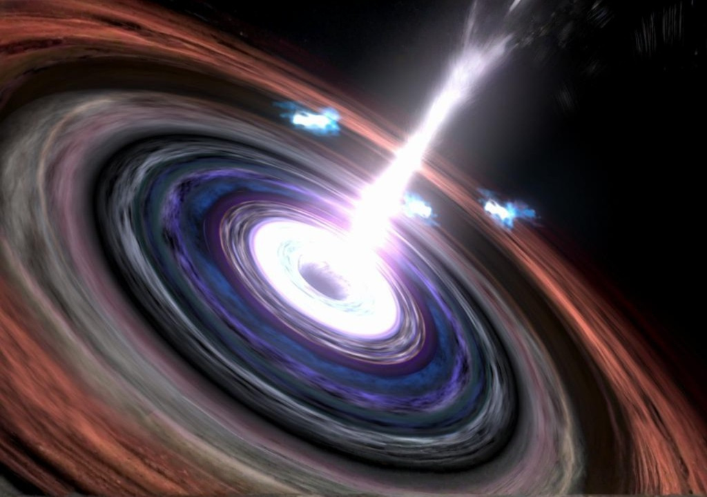 Ilustración de un blázar. Ilustración de un blázar: un agujero negro supermasivo rodeado por un disco de acreción que expulsa un potente chorro relativista de energía hacia el espacio, visible como uno de los fenómenos más extremos y luminosos del universo. Créditos: NASA/JPL-Caltech.