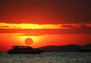 How often can we witness a total eclipse of the Sun in the same place?