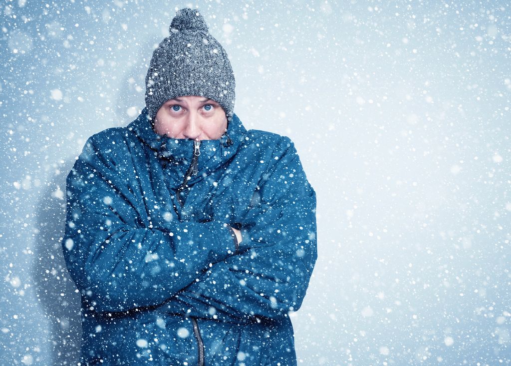 Frozen man in a blue jacket