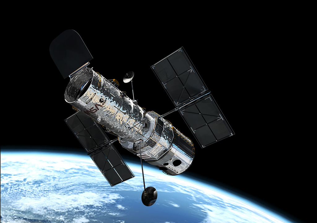 Telescópio Hubble possui instrumentos capazes de observar luz emitida por quasares distantes. Telescópio Hubble possui instrumentos capazes de observar luz emitida por quasares distantes.
