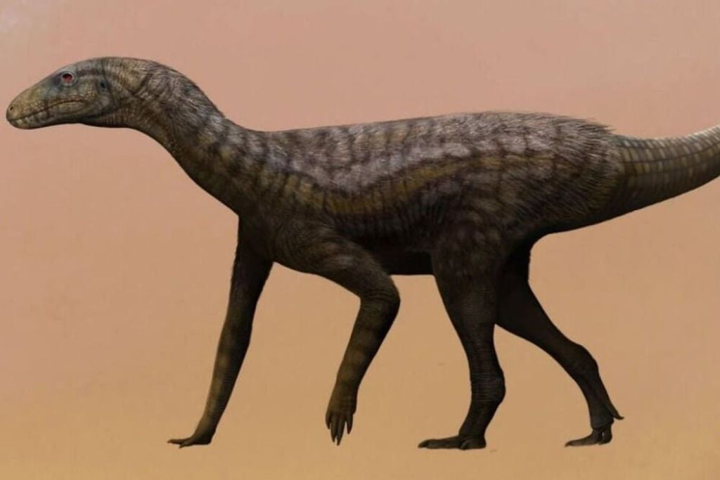 Gondwanax paraisensis mostrado em uma paisagem Triássica, milhões de anos atrás, no sul do Brasil. Crédito: SWNS