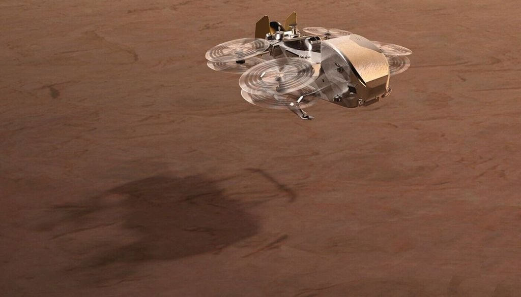 Künstlerkonzept, das Dragonflys Rotoren in Aktion über Titan zeigt. Künstlerkonzept, das Dragonflys Rotoren in Aktion über Titan zeigt. Bild: NASA/Johns Hopkins APL