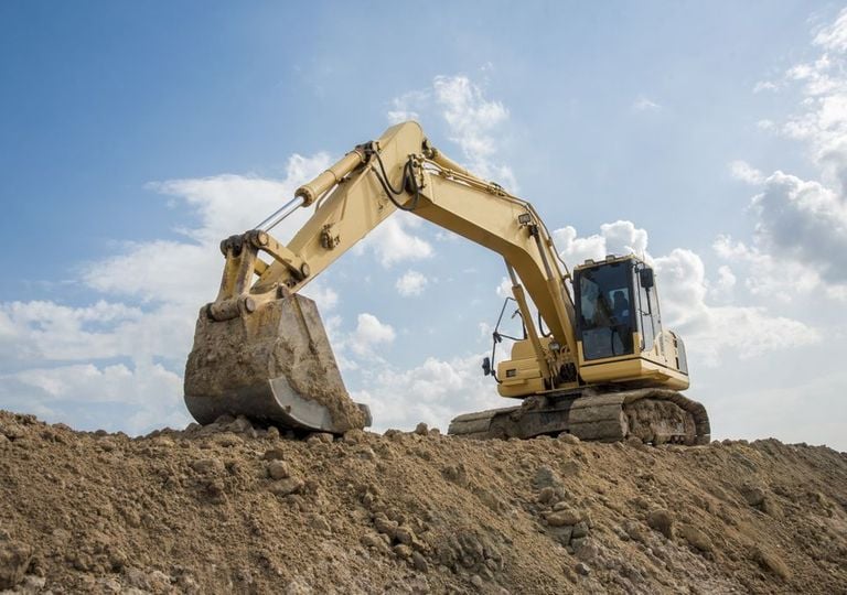 Excavadora sobre arena Excavadora sobre arena