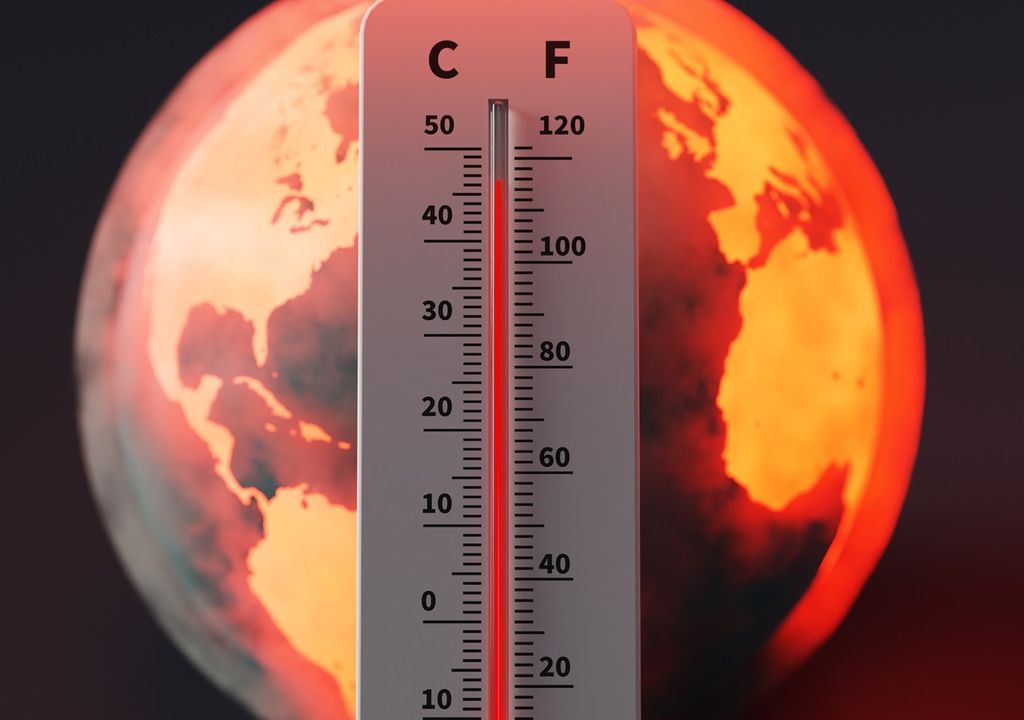 Termómetro marcando altas temperaturas frente a la imagen de un planeta en tonos anaranjados