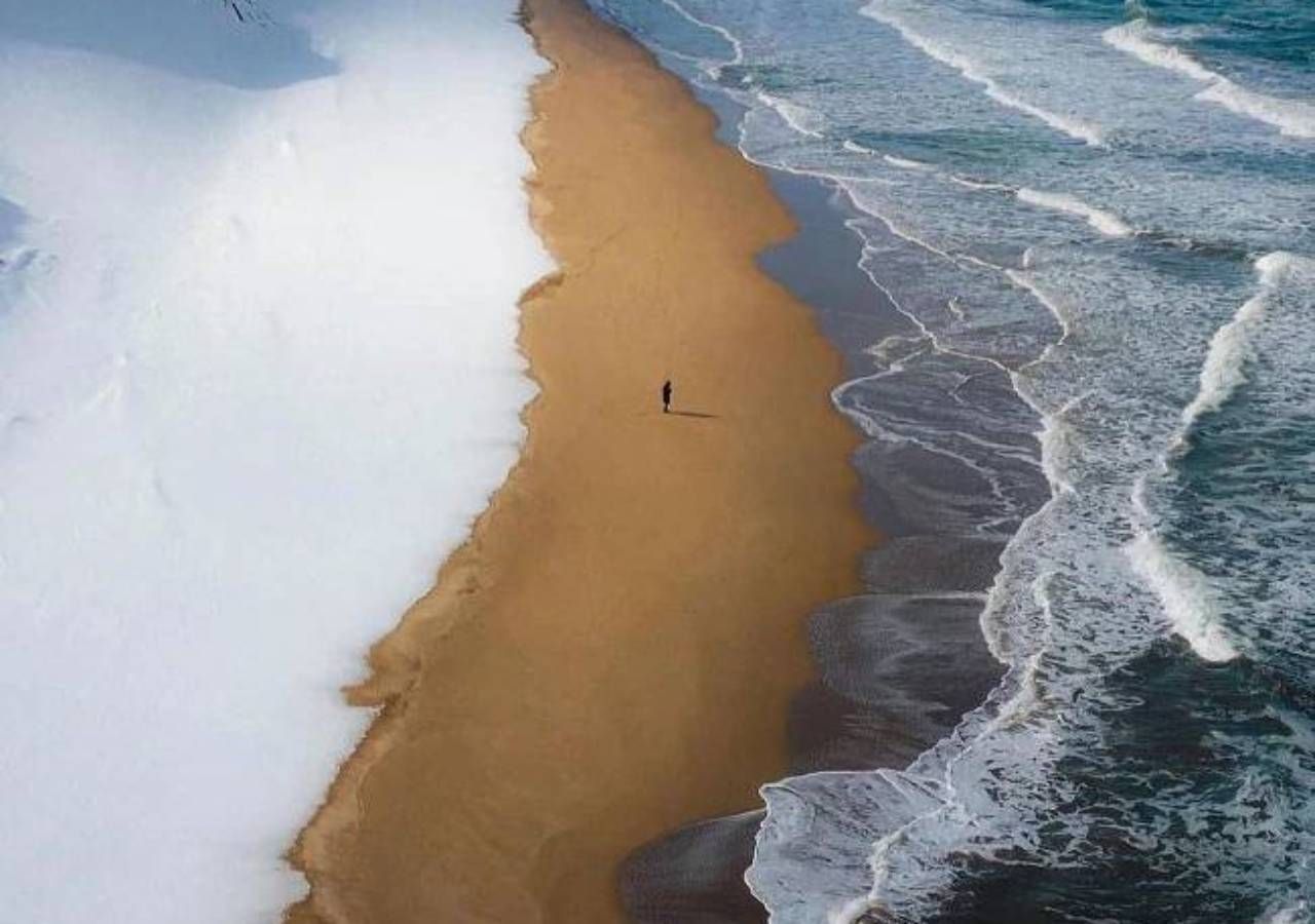 Everyone is crazy about this beach: sea, sand and snow meet and form an  extraordinary landscape