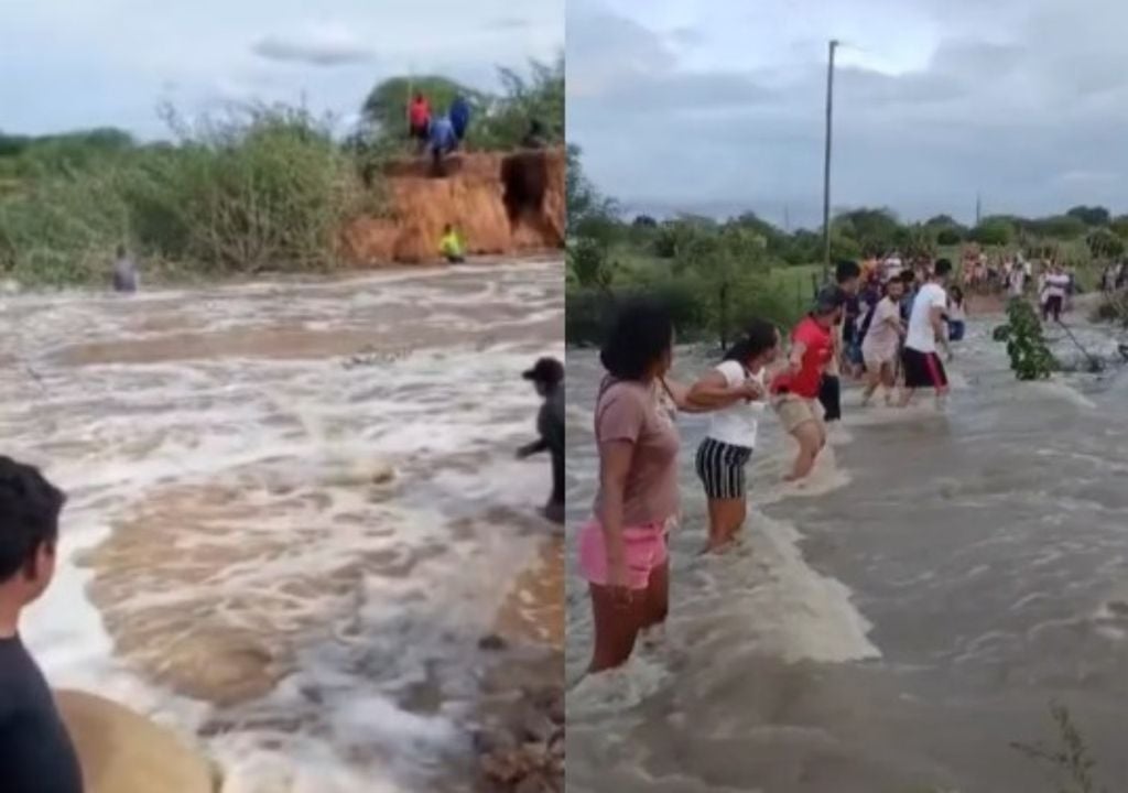 População faz "corrente humana" para passar por riacho em Retirolândia. Foto: Reprodução/ Redes Sociais