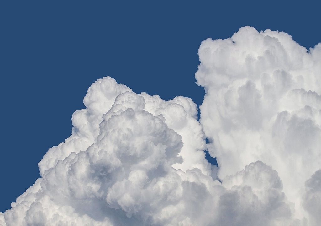 Thunderstorms originate from cumulonimbus clouds which contain warm and moist rising thermals. These clouds extend very high in the atmosphere.