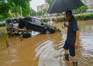 Shocking images of severe flooding and the rescue of a man in China