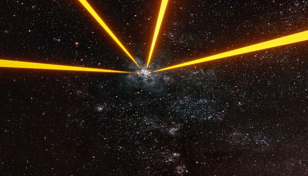 L'image publiée par l'ESO montre quatre faisceaux laser dirigés vers la nébuleuse de la Tarentule - Image A. Berdeu/ESO