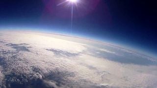 Stratospheric air intrusions into the troposphere promote the formation of new particles on a global scale