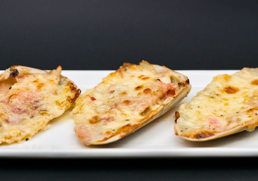 Las machas a la parmesana son una de las preparaciones estrella de la gastronomía chilena.