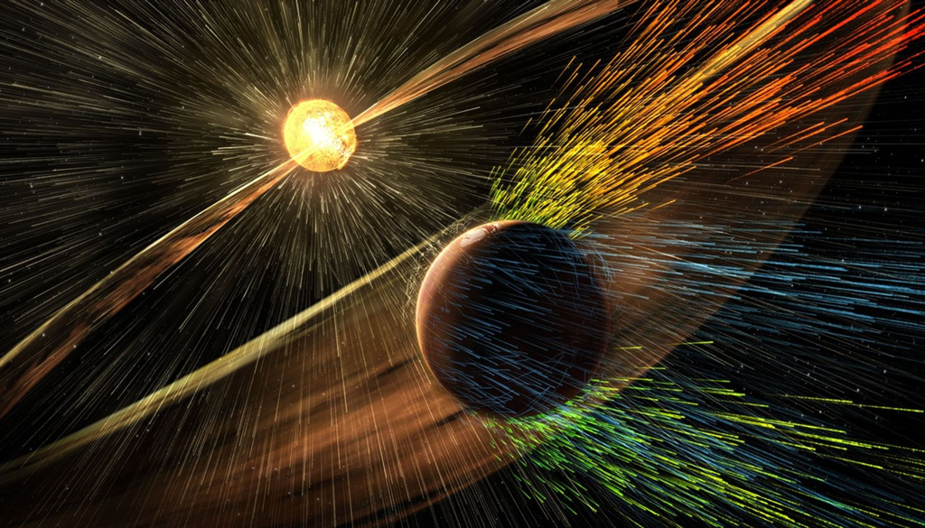 Esta ilustración muestra partículas cargadas procedentes de una tormenta solar que desprenden partículas cargadas de la atmósfera de Marte, uno de los procesos de pérdida de atmósfera marciana estudiados por la misión MAVEN de la NASA. NASA/GSFC