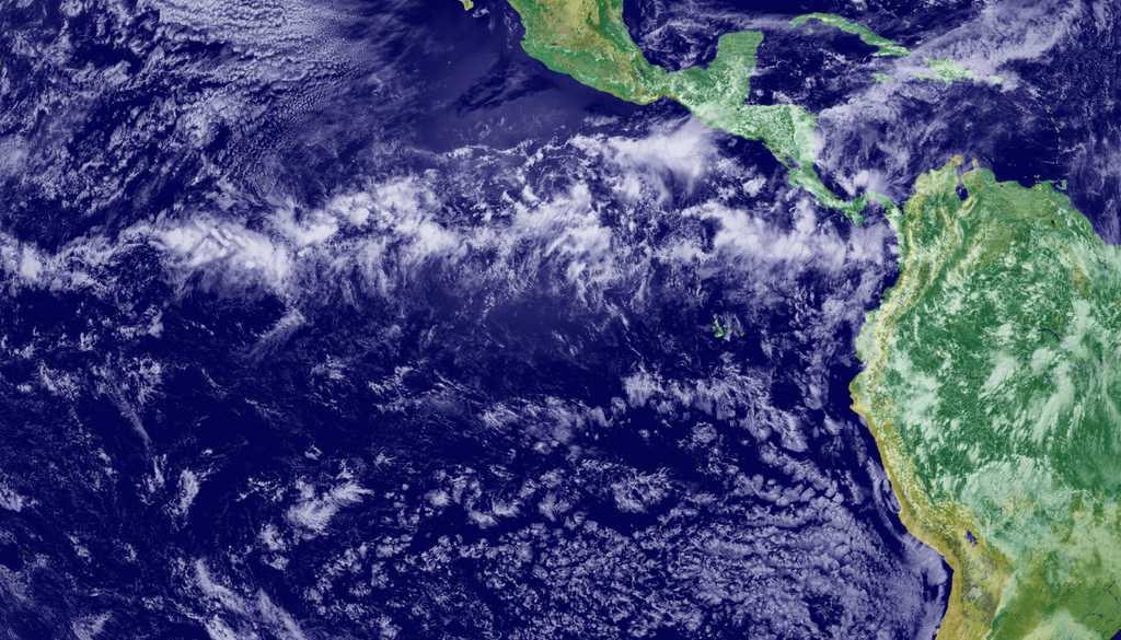 La banda de nubes intensas que cruza la región ecuatorial (ITCZ) es donde convergen los vientos alisios de ambos hemisferios. Imagen tomada de la NASA.