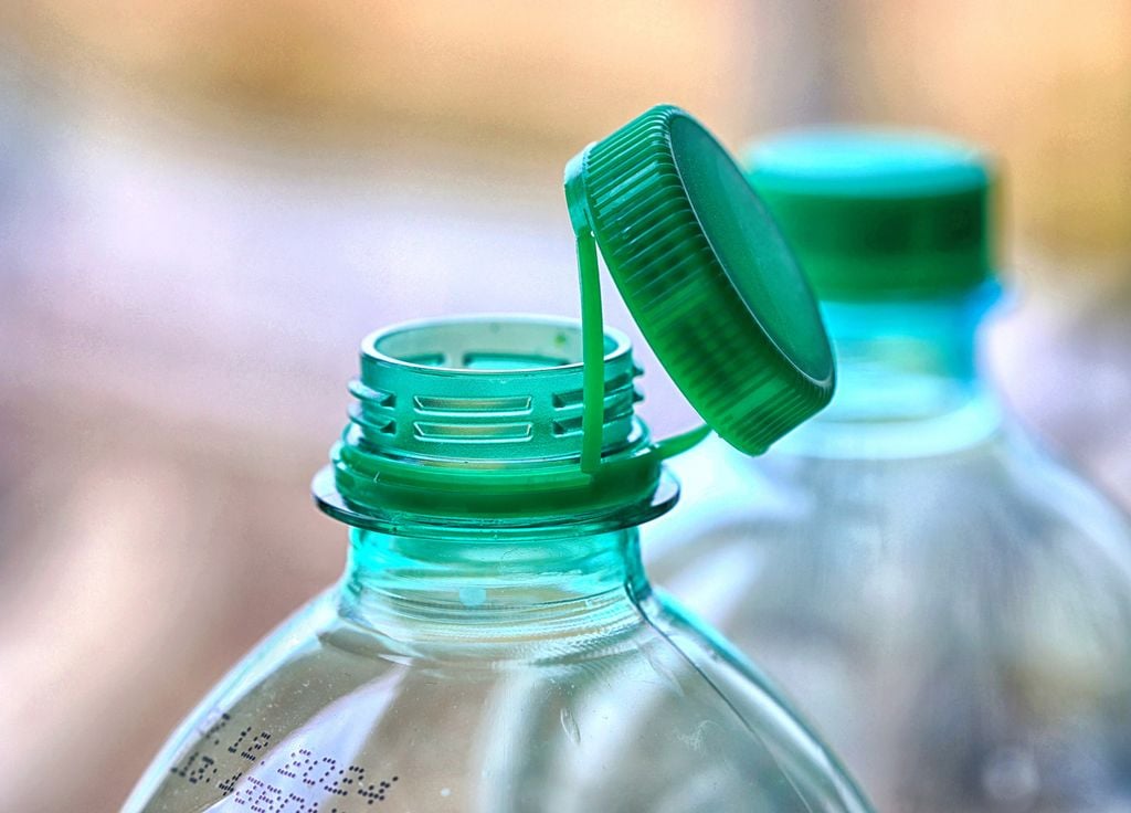 Cap attached plastic bottle