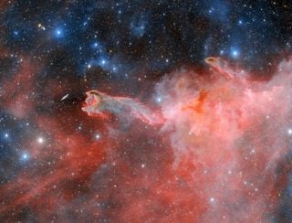 Los astrónomos observan la “mano de Dios” emergiendo desde una nebulosa