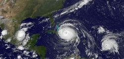 Global warming intensifies rainfall in tropical cyclones and makes them more extensive