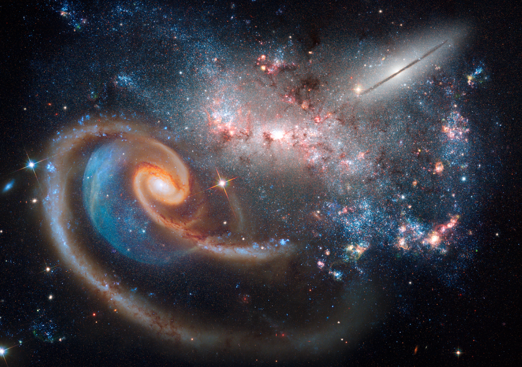 Ein Beispiel für komplexe Systeme sind Galaxien und die Interaktion zwischen ihnen bei einer Kollision.