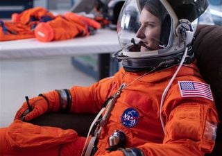 Why is the astronaut's suit orange during takeoff?