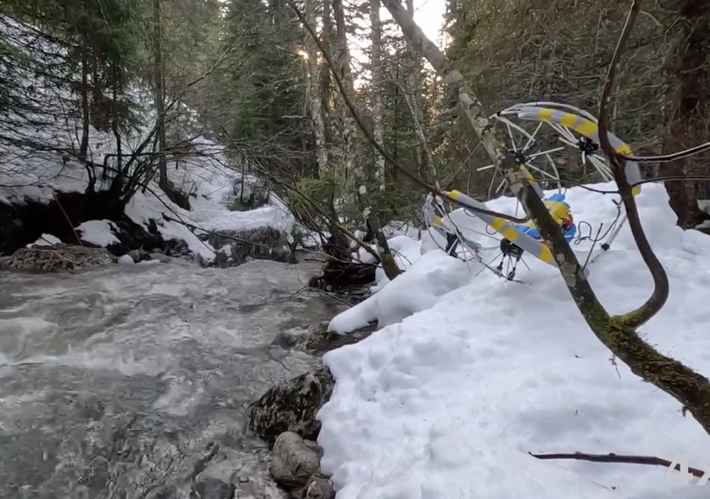 The robot can handle snow and even change its form to roll down a slope.