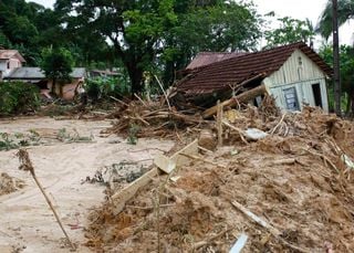 Slow-moving mudslides: an overlooked threat to mountain communities expanding on steep slopes