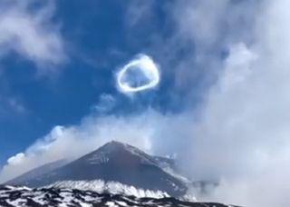Spectacular smoke ring seen above Mount Etna crater