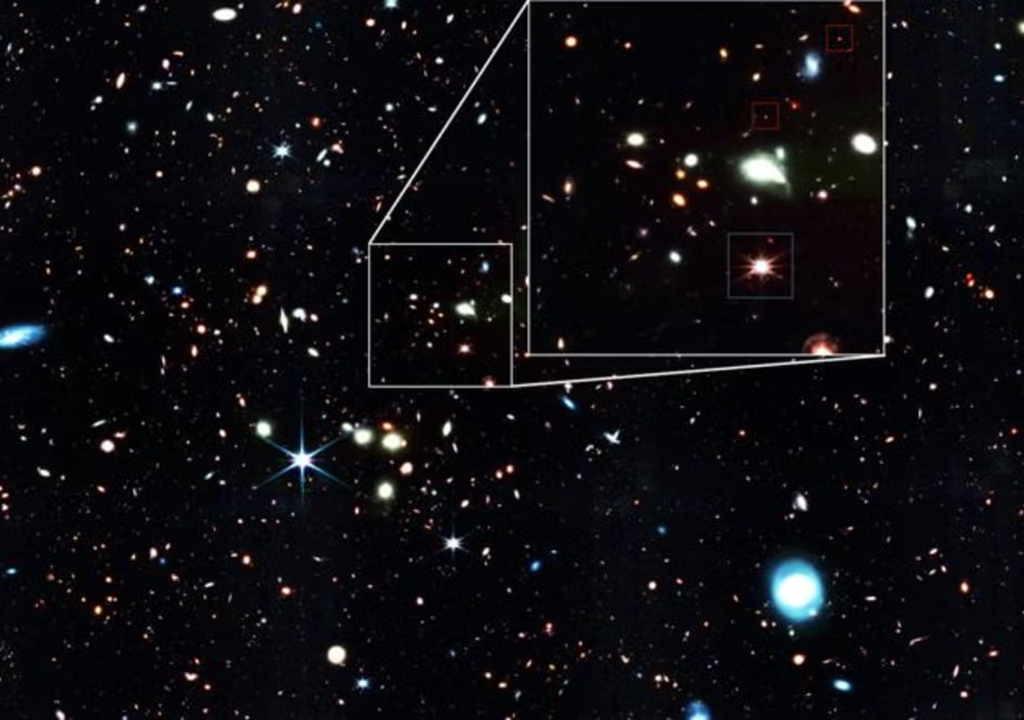 Imagem nova do JWST mostra pontos vermelhos que são buracos negros. Imagem nova do JWST mostra pontos vermelhos que são buracos negros.