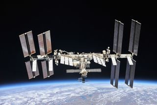 The International Space Station performs a calculated maneuver, avoiding debris from an inoperative satellite