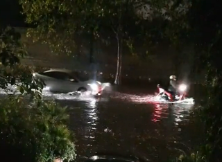 Travel chaos in London after heavy rain causes flooding