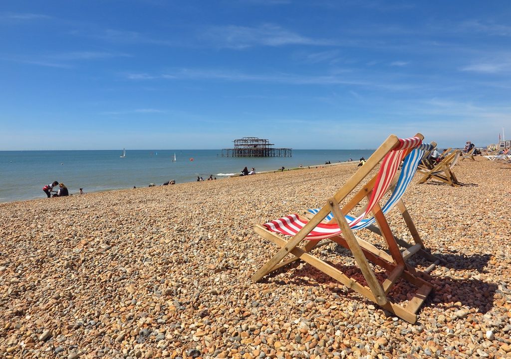 Deckchairs on beach.