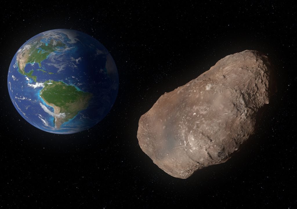 asteroide y planeta Tierra en el espacio