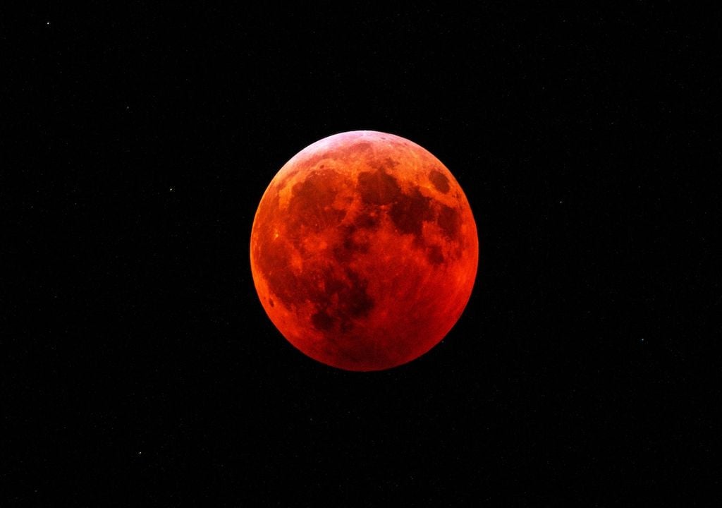 Experience the breathtaking beauty of a Blood Moon during the total lunar eclipse on 14th March, when the Moon takes on a striking reddish hue in UK skies.