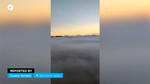 The mists of advection engulf the skyscrapers of Benidorm, Spain